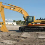 CAT 345BL excavator with durable bucket and crane features, priced to fit your needs.