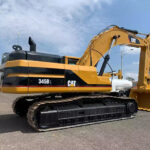CAT 345BL excavator with durable bucket and crane features, priced to fit your needs.