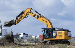 Caterpillar 330F excavator with diesel engine, optimal dimensions, and powerful performance.